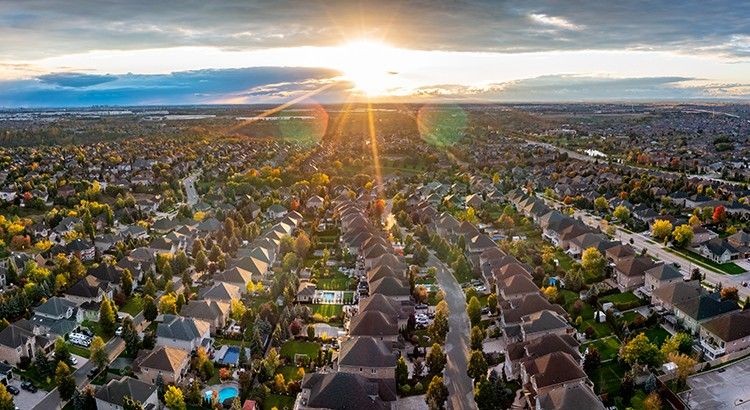 image with  houses with a bright sun in a busy family community